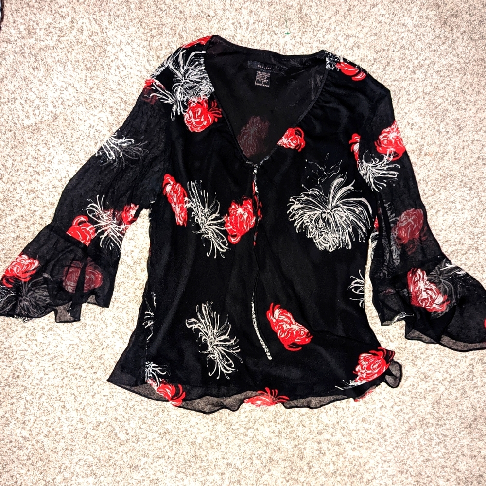 Silklano blouse lined inside. has bell sleeves ... Thin but not see thru..size L